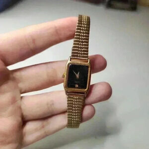 Seiko Women's Gold and Black Watch